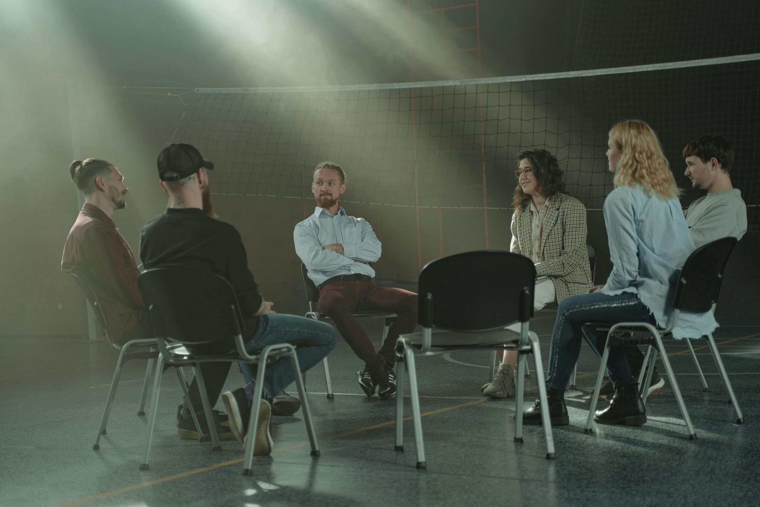 Al-Anon Family Group meeting with family members supporting each other through a loved one’s alcohol addiction